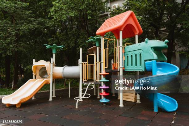 children's slides - playground stock pictures, royalty-free photos & images