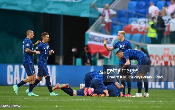 Robert Mak of Slovakia celebrates with team mates after scoring their side's first goal during the UEFA Euro 2020 Championship Group E match between...