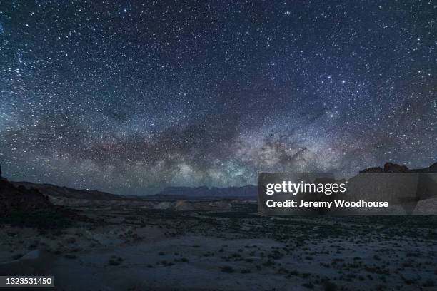 milky way rising from behind the chisos mountains - chisos mountains stock pictures, royalty-free photos & images