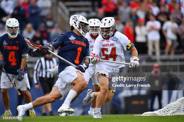 Nick Grill of the Maryland Terrapins defends Connor Shellenberger of the Virginia Cavaliers during the Division I Men’s Lacrosse Championship held at...