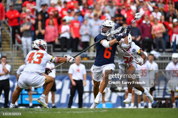 Dox Aitken of the Virginia Cavaliers passes the ball against the Maryland Terrapins during the Division I Men’s Lacrosse Championship held at Pratt...