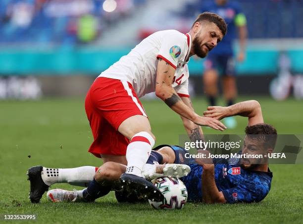 Mateusz Klich of Poland battles for possession with Jakub Hromada of Slovakia during the UEFA Euro 2020 Championship Group E match between Poland and...