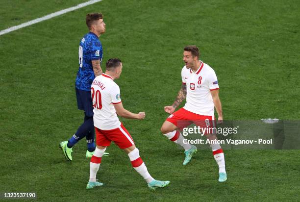 Karol Linetty of Poland celebrates with Piotr Zielinski after scoring their side's first goal during the UEFA Euro 2020 Championship Group E match...