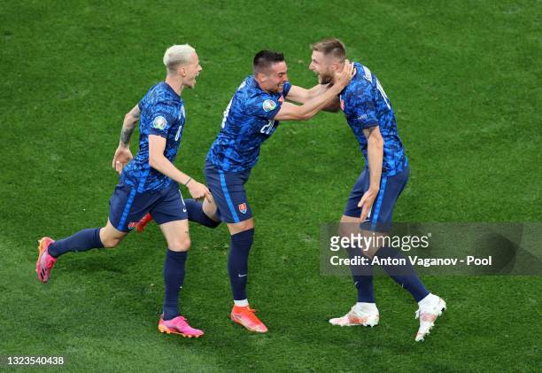 Milan Skriniar of Slovakia celebrates with Robert Mak after scoring their side's second goal during the UEFA Euro 2020 Championship Group E match...