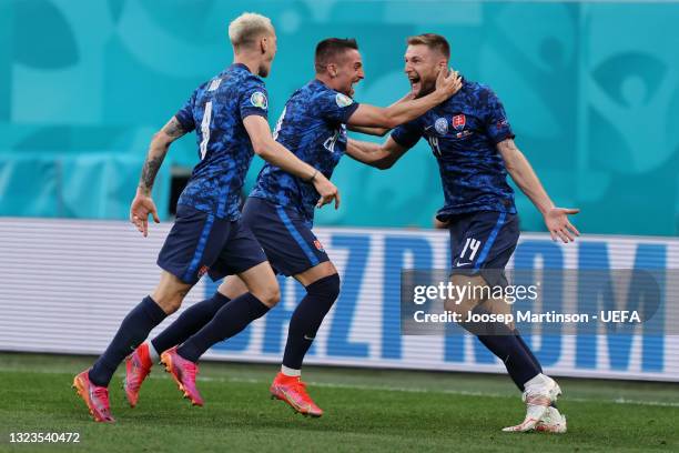 Milan Skriniar of Slovakia celebrates with Robert Mak after scoring their side's second goal during the UEFA Euro 2020 Championship Group E match...