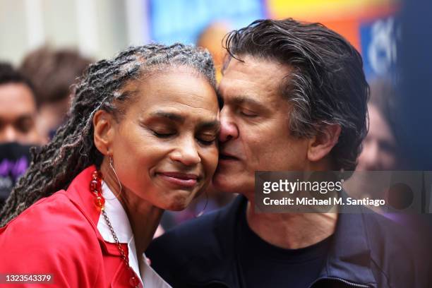 New York City Mayoral candidate Maya Wiley and her husband Harlan Mandel embrace during a small press conference after voting early at Erasmus Hall...