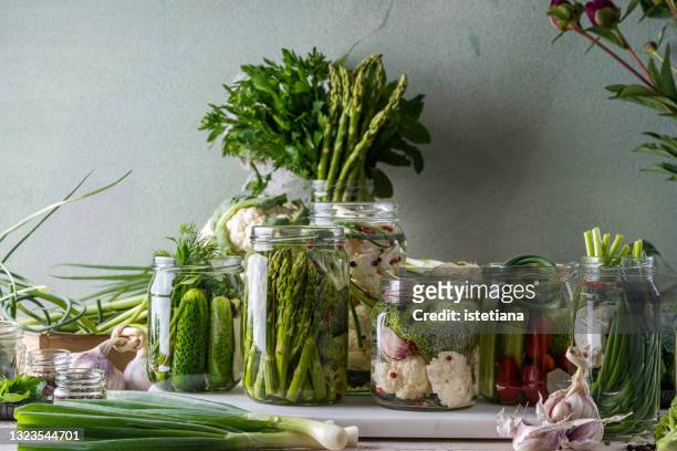 canning process. white and green, fermented foods - pickle jar imagens e fotografias de stock