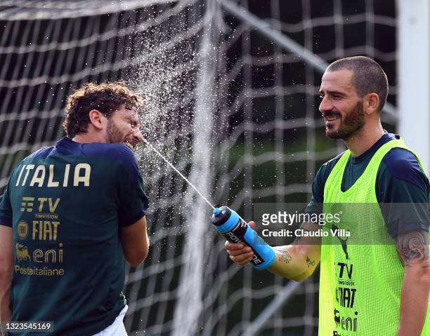 Manuel Locatelli and Leonardo Bonucci of Italy in action during a Italy training session at Centro Tecnico Federale di Coverciano on June 14, 2021 in...