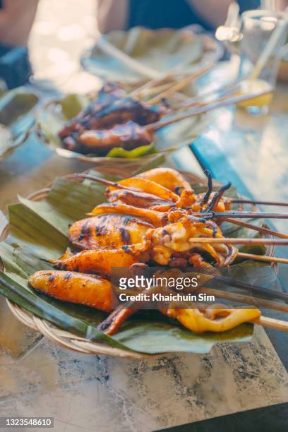 barbecue squid calamari skewers - bohol stock pictures, royalty-free photos & images