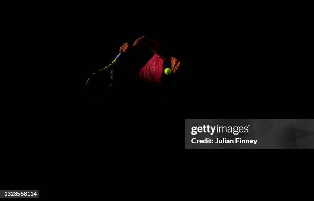 Jo-Wilfried Tsonga of France serves in their mens singles first round match against Yoshihito Nishioka of Japan on day two of the 2021 French Open at...