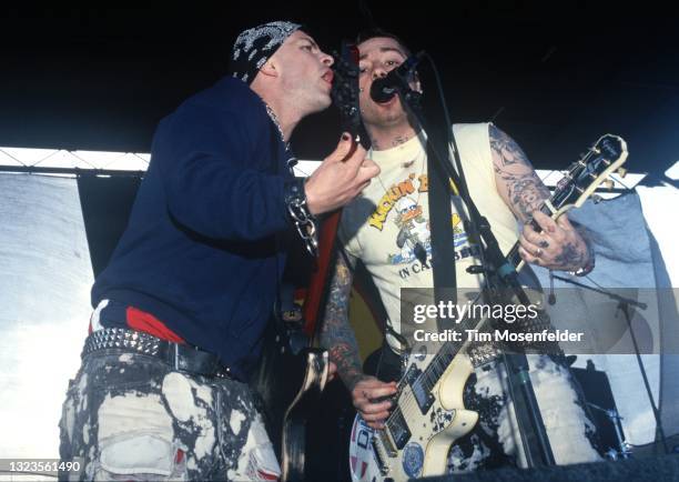 Tim Armstrong and Lars Frederiksen of Rancid perform during the "Vans Warped Tour" at Pier 30/32 on July 5, 1998 in San Francisco, California.