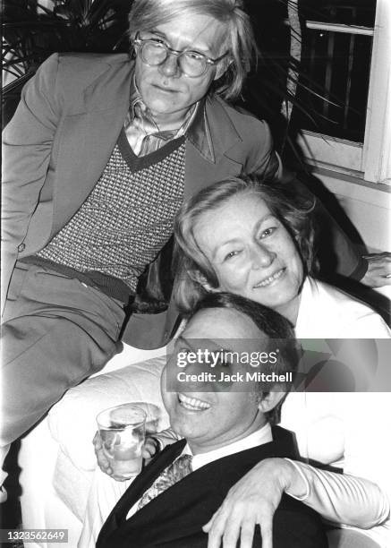 View of artist Andy Warhol, photographer Jack Mitchell, and actress Veronica Lake as they attend a party, January 1971. The party, hosted by...