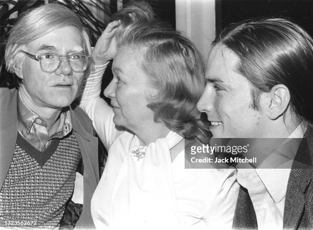 View of artist Andy Warhol, actress Veronica Lake, and actor Joe Dallesandro as they attend a party, January 1971. The party, hosted by photographer...