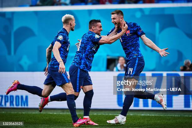Milan Skriniar of Slovakia celebrates with Robert Mak after scoring their side's second goal during the UEFA Euro 2020 Championship Group E match...