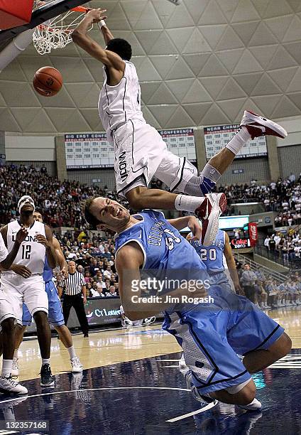 Jeremy Lamb of the Connecticut Huskies dunks the ball as Mark Cisco of the Columbia Lions gets a knee to the face in the second half at Harry A....