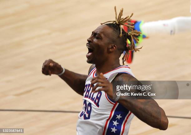 Dwight Howard of the Philadelphia 76ers reacts after a dunk against the Atlanta Hawks during the first half of game 4 of the Eastern Conference...