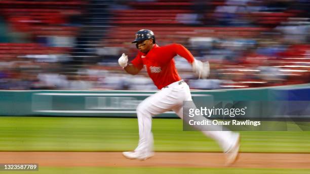 Rafael Devers of the Boston Red Sox runs to second base in the bottom of the second inning of the game against the Toronto Blue Jays at Fenway Park...