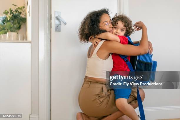 big cuddles good-bye from mum - first day of school australia stock pictures, royalty-free photos & images