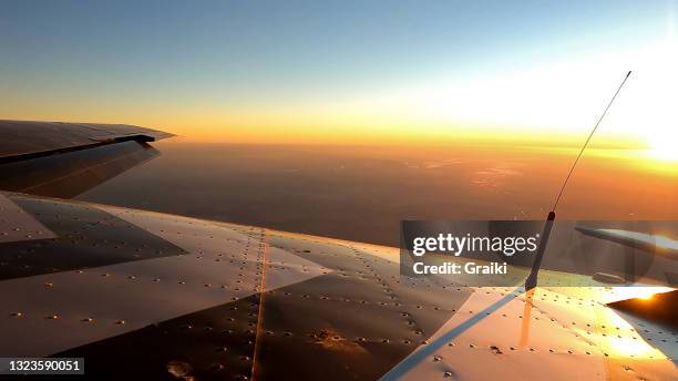 image of the plane at 13000 feet with the sun on the horizon. - skydive close up stock pictures, royalty-free photos & images