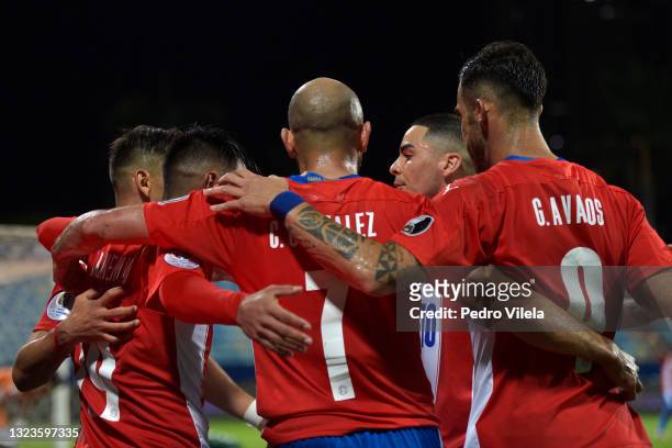 Angel Romero of Paraguay celebrates with teammates after scoring the second goal of his team during a Group A match between Paraguay and Bolivia at...