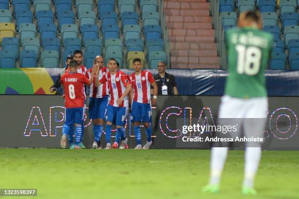 Angel Romero of Paraguay celebrates with teammates after scoring the second goal of his team during a Group A match between Paraguay and Bolivia at...