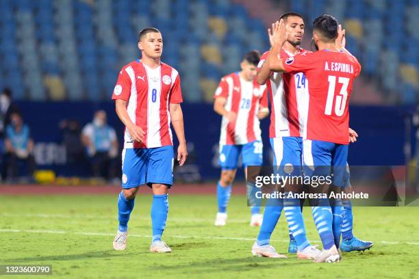 Alberto Espinola of Paraguay celebrates with teammate Hector Martinez after winning a Group A match between Paraguay and Bolivia at Estádio Olímpico...