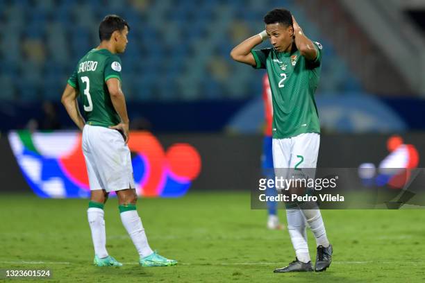 Jose Sagredo and Jairo Quinteros of Bolivia react after losing a Group A match between Paraguay and Bolivia at Estádio Olímpico as part of Copa...