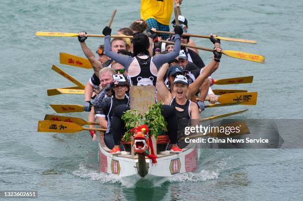 Competitors paddle in a dragon boat race on the Dragon Boat Festival on June 14, 2021 in Hong Kong, China. The Dragon Boat Festival is celebrated on...