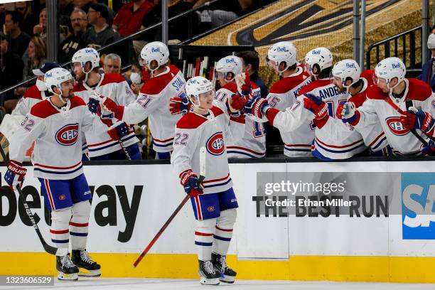 Cole Caufield of the Montreal Canadiens is congratulated by his teammates after scoring a goal against the Vegas Golden Knights during the second...