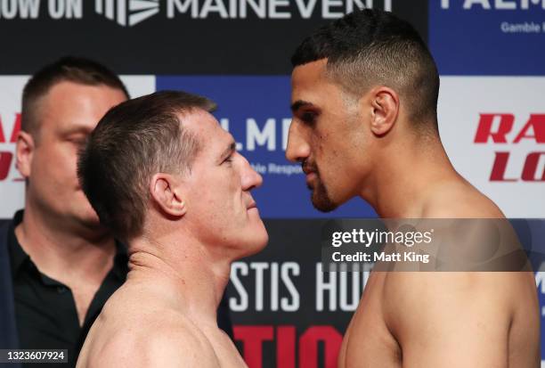 Paul Gallen and Justis Huni face off during the official weigh-in at ICC Sydney on June 15, 2021 in Sydney, Australia.
