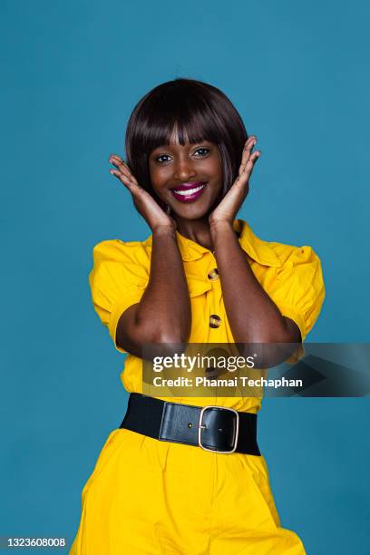 beautiful woman in yellow outfit - not listening stock pictures, royalty-free photos & images