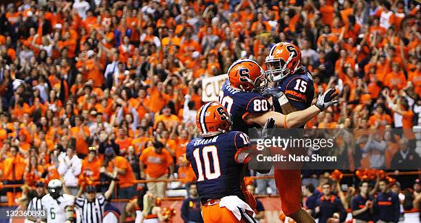 Syracuse Orange players Dorian Graham and Nick Provo celebrate after a touchdown by Alec Lemon during the game against the South Florida Bulls at the...