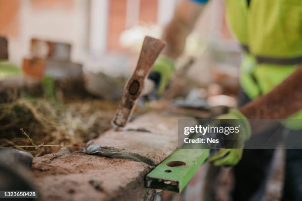 brick masonry - spirit level stock pictures, royalty-free photos & images