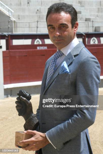 Enrique Ponce poses after receiving the special golden ear for his 30 continuous years of profession, on June 15 in Madrid, Spain.