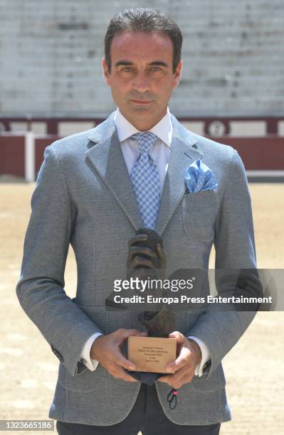 Enrique Ponce poses after receiving the special golden ear for his 30 continuous years of profession, on June 15 in Madrid, Spain.