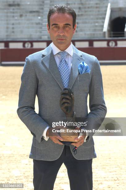 Enrique Ponce poses after receiving the special golden ear for his 30 continuous years of profession, on June 15 in Madrid, Spain.