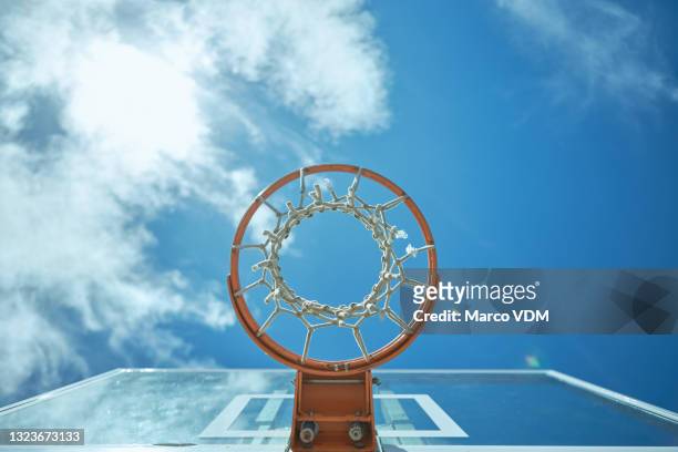 cropped shot of a basketball net on a sunny day outside - back board stock pictures, royalty-free photos & images