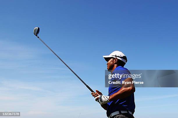 Tiger Woods of the USA prepares to hit his third shot on on the 11th Hole during day three of the 2011 Emirates Australian Open at The Lakes Golf...