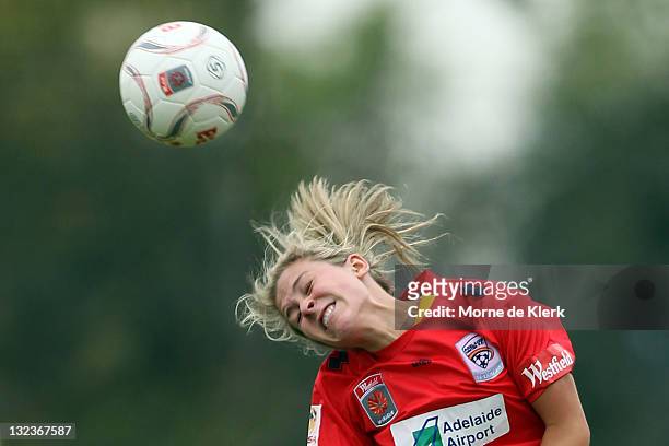 Katherine Ebbs of Adelaide heads the ball during the round four W-League match between Adelaide United and the Brisbane Roar at Burton Park on...