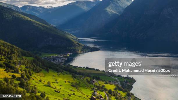 scenic view of lake and mountains against sky,aurland,sogn og fjordane,norway - sogn og fjordane county stock pictures, royalty-free photos & images