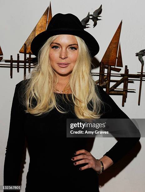 Actress Lindsay Lohan attends the Lana Gomez Art Show at Roseark on November 11, 2011 in Los Angeles, California.