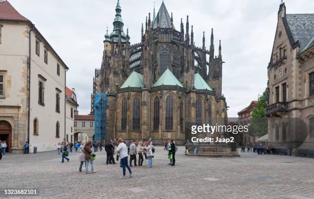 tourists at the west side of the st. vitus cathedral in prague - stained glass czech republic stock pictures, royalty-free photos & images