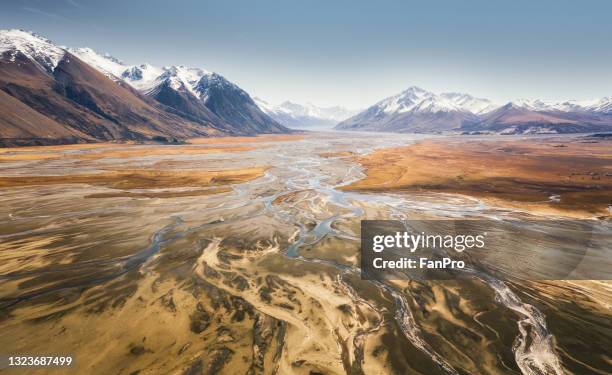 snow mountain and stream - south island new zealand stock pictures, royalty-free photos & images