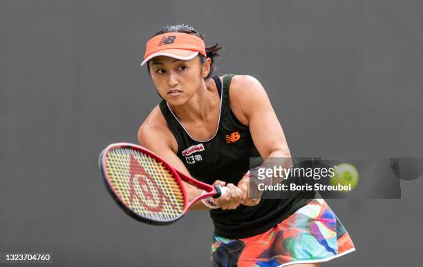 Misaki Doi of Japan hits a backhand against Angelique Kerber of Germany in the women's singles match during day 4 of the bett1open at LTTC Rot-Weiß...
