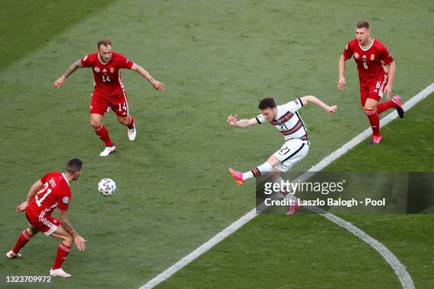 Diogo Jota of Portugal shoots whilst under pressure from Gergo Lovrencsics and Willi Orban of Hungary during the UEFA Euro 2020 Championship Group F...
