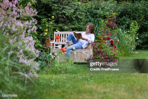 gardening - woman enjoy relaxing in the garden - central europe stock pictures, royalty-free photos & images