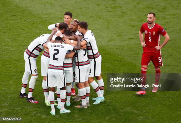 Raphael Guerreiro of Portugal celebrates with team mates after scoring their side's first goal during the UEFA Euro 2020 Championship Group F match...