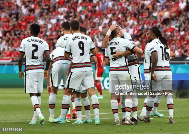 Raphael Guerreiro of Portugal celebrates with Pepe and team mates after scoring their side's first goal during the UEFA Euro 2020 Championship Group...