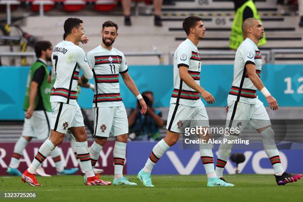 Cristiano Ronaldo of Portugal celebrates with Bruno Fernandes and team mates after scoring their side's second goal during the UEFA Euro 2020...