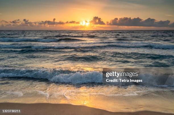 usa, florida, boca raton, sea waves and clouds at sunrise - ボカラトン ストックフォトと画像